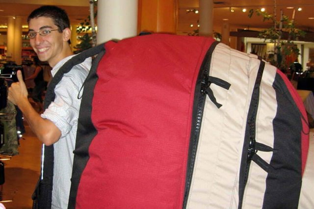 a complete, higher resolution picture of a person wearing an oversized backpack